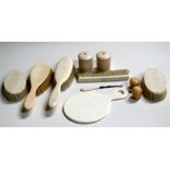 An Edwardian ivory part dressing table set,