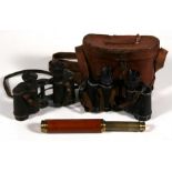 Two pairs of wartime Military binoculars, Goerz and Zeiss; together with a mahogany and lacquered