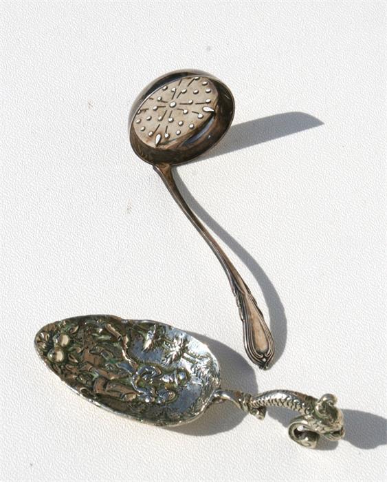 A silver sugar sifter together with a continental caddy spoon (2).
