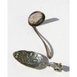 A silver sugar sifter together with a continental caddy spoon (2).