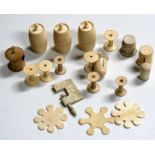 A group of 19th century ivory sewing items to include thread winder, clamp, and tape measure,