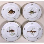 Four Richard Ginori plates, decorated with fish, 26cm (10.25ins) diameter.