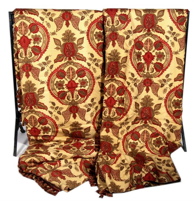 A pair of Baker Print curtains decorated with flowers on a gold ground.293cm by 254cm (115 by