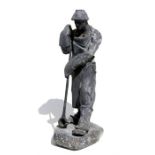 K E Nieschlagg, cast figure of a steel working, signed and dated 1957 with foundry stamp, 40cm (15.