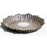 A George IV circular silver dish with embossed decoration, London 1829, 14cms (5.5ins) diameter.