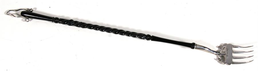 An ebony handled silver toasting fork, Chester 1895, 45cm (17.75ins) long. Condition Report Handle