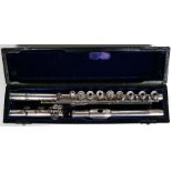 A Ewen McDougall silver three-piece flute, Sheffield 1992, 67cm (23.25ins) long, cased.