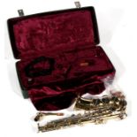 A Corton brass saxophone, cased.