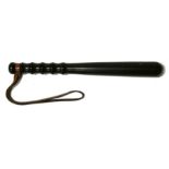 A turned mahogany truncheon with leather wrist strap, 28.5cm (15ins) long