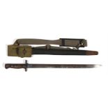 A 1907 pattern British bayonet in its leather scabbard, 27.5cm (22.25ins) long.