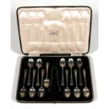 A cased set of 12 silver teaspoons, with sugar tongs, Sheffield 1935.