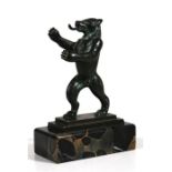 A bronze figure in the form of a standing bear mounted on a figured marble plinth, 16cm (6.25ins)
