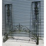 A large wrought iron garden arch 160 by 260cm (63 by 102.5ind) high