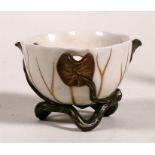 A Royal Worcester ceramic three-spouted creamer in the form of a lily, 11.5cm (4.5ins) diameter.