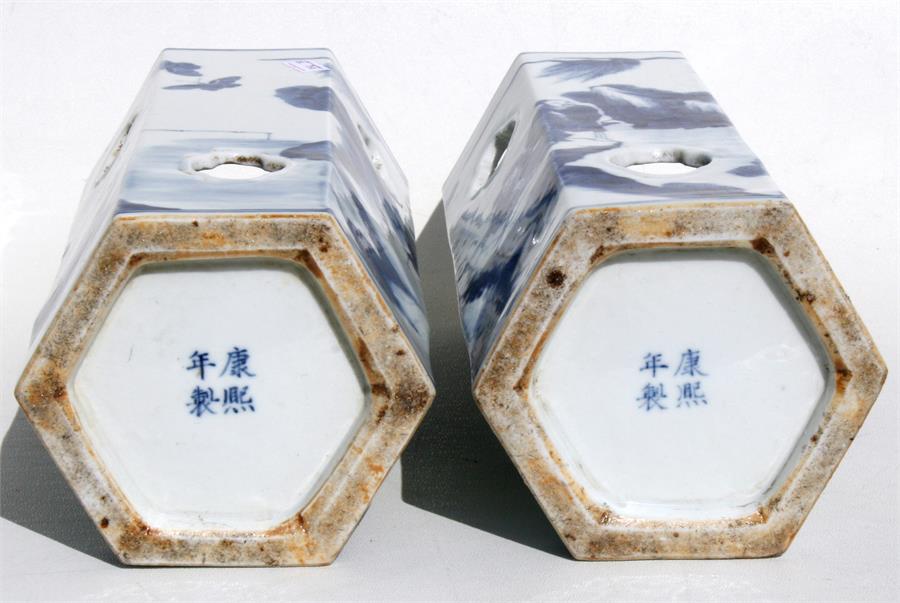 A pair of Chinese hexagonal form blue & white wig stands decorated with figures in a landscape, with - Image 2 of 8