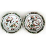 A pair of Kangxi famille rose ten-sided shallow bowls decorated with birds and flowers, 22cms (8.