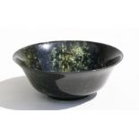 A spinach jade bowl, 15cms (6ins) diameter. (a/f) Condition Report Broken and restored.