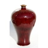 A Chinese sang de boeuf Meiping vase with impressed seal mark to underside, 29cms (11.5ins) high.