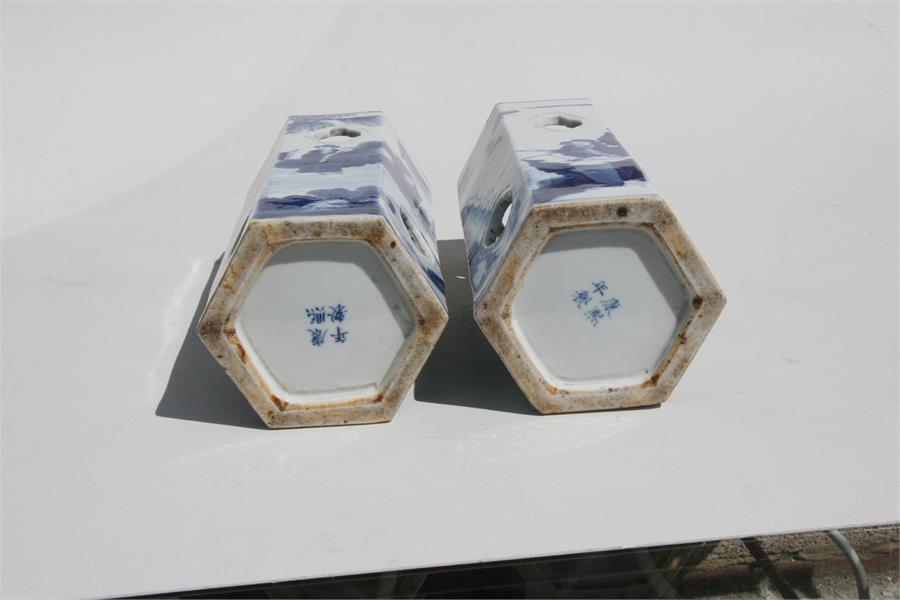 A pair of Chinese hexagonal form blue & white wig stands decorated with figures in a landscape, with - Image 8 of 8