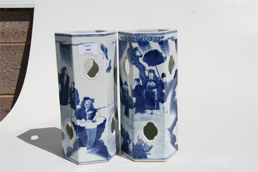 A pair of Chinese hexagonal form blue & white wig stands decorated with figures in a landscape, with - Image 3 of 8