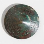 A Chinese Warring State style bronze belt buckle, 6.5cms (2.5ins) diameter.