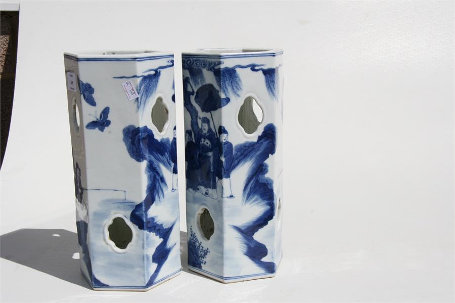 A pair of Chinese hexagonal form blue & white wig stands decorated with figures in a landscape, with - Image 4 of 8