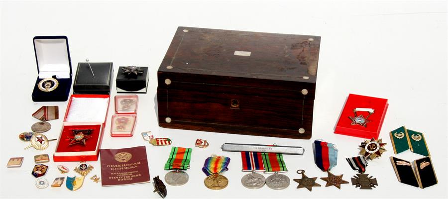 A rosewood and inlaid box containing a WWI War for Civilisation 1914-1919 medal awarded to '1338