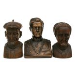 A pair of continental carved wooden busts depicting an elderly lady and elderly gentleman, 20cms (