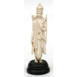 An Indian carved ivory figure of a deity with bow & arrows, on wooden plinth, 13.5cms (5.5ins)