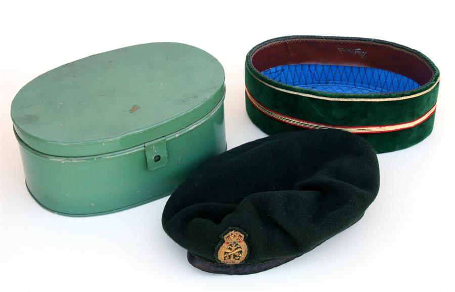 A Royal Brunei Malay Regiment officers Songkok in its original tin transit case and a Beret.