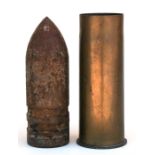 A complete inert WW1 German artillery shell. The brass casing dated 1917 and made by