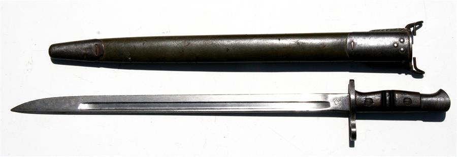 A very clean example of a USA model 1917 Enfield bayonet marked Remington to the blade in its