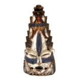 African / Tribal Art - a carved and painted wooden Igbo mask from the Nsukka area, 56cms (22ins)