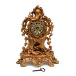 A 19th century French gilded mantle clock, the brass dial with enamel Roman numerals, signed '