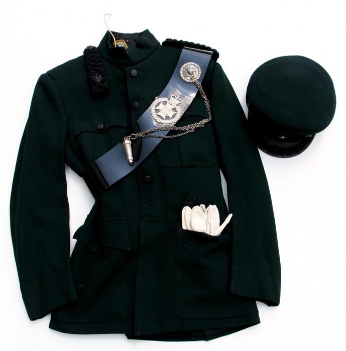 Lieutenant Colonel V. Robinson, his 6th Gurkha Rifles green uniform comprising jacket with black