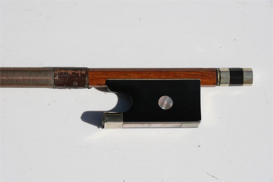 A mahogany violin bow with mother of pearl inlaid frog, in a pine carry box, 75cms (29.5ins) long. - Image 6 of 7