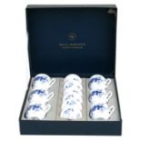 A boxed set of Royal Worcester Rhapsody pattern chocolate cups & covers.