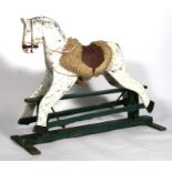 An early 20th century painted wooden rocking horse, 119cms (47ins) long.