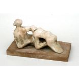 A Henry Moore style plaster maquette in the form of a reclining lady, mounted on an oak plinth,