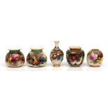 A group of five Royal Worcester vases decorated with flowers and fruit, the largest 11.2cms (4.3ins)