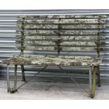 A well weathered teak & wrought iron garden bench, 122cms (48ins) wide.