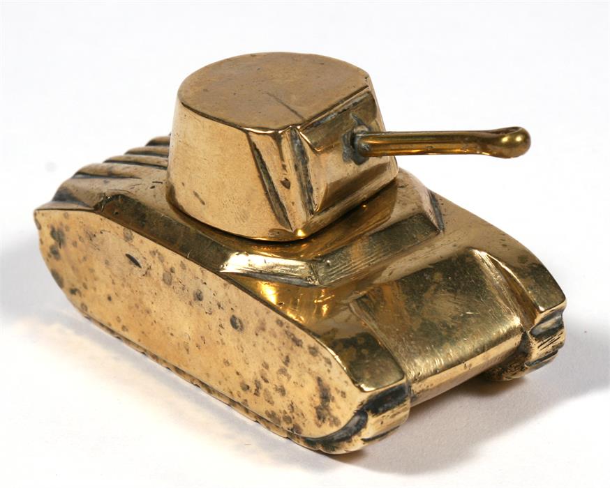 A WW2 brass vesta in the form of a tank. 9.5cms (3.75ins) long by 4.5cms (1.75ins) wide and 5cms (