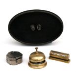 A reproduction Stanley compass, a brass counter bell, an ebony dressing table tray mounted with