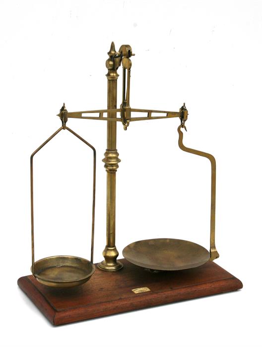 A set of late 19th / early 20th century brass pharmaceutical beam scales with ivory plaque inscribed