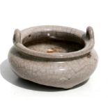 A Chinese crackle glaze two-handled censer of compressed circular form, 12cms (4.75ins) diameter.