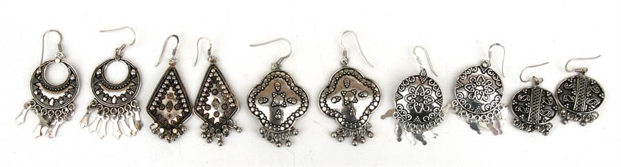 Five pairs of ornate 925 sterling silver earrings.