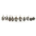 Five pairs of ornate 925 sterling silver earrings.