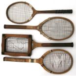 Four vintage tennis rackets.