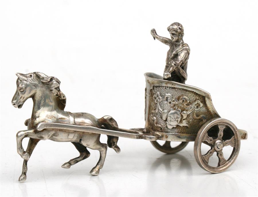 A continental silver model of a Roman Gladiator on a chariot, 9cms (3.4ins) long.