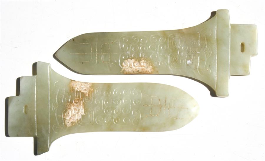 A pair of Chinese jade archaic style dagger blades, 15cms (6ins) long (2).